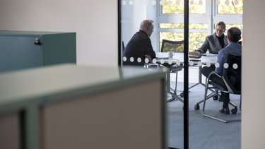 Team members in a meeting room
