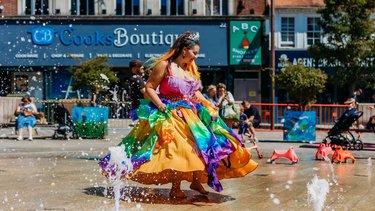 A party princess dances in Letchworth town centre at a community event
