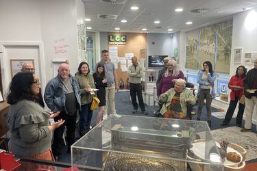 A group of people gathered in Museum at One Garden City