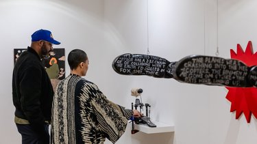 People look at the art at Broadway Gallery