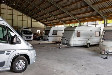 Caravans and campers from private individuals in a large shed