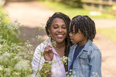 A mother and daughter look at flowers at Standalone Farm.