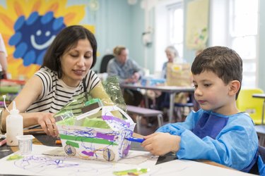 An adult and child drawing together at Broadway Gallery's Family Arts.