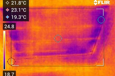 A thermal camera image of a loft hatch, showing heat escaping.