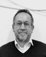 A headshot of Gary Adcock