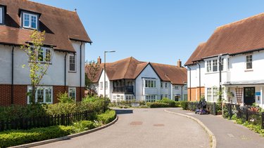 White houses with brown roofs.