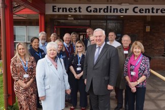 members of the Garden House Hospice Care Care team, patients, Pam Burn (ex-Chair of the Heritage Foundation), Steve Mellish (Chair of Garden House Hospice Care), Graham Fisher (CEO Heritage Foundation), Gareth Hawkins (Chair Heritage Foundation) and Sir Oliver Heald MP.